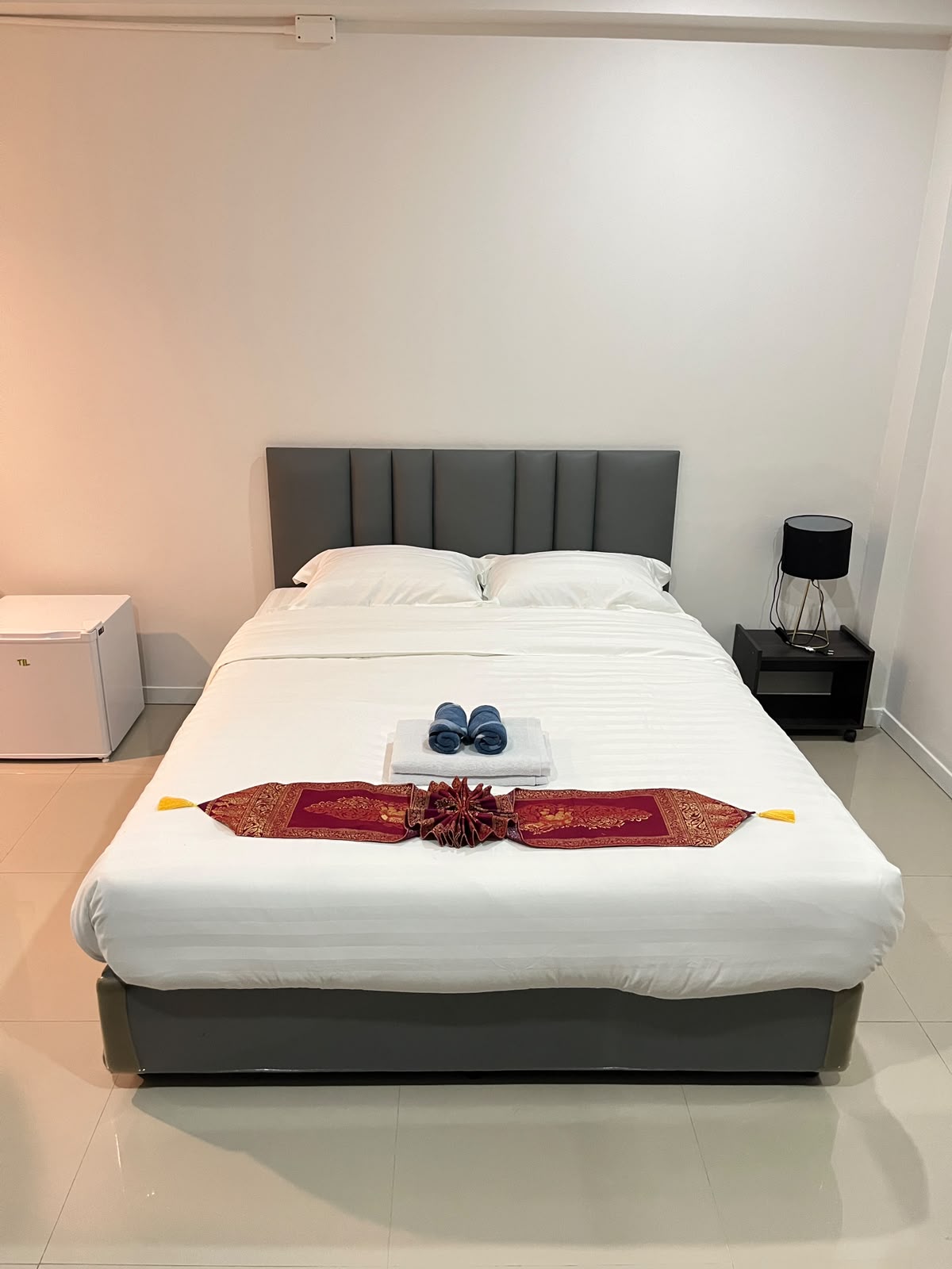 Double bed with grey headboard